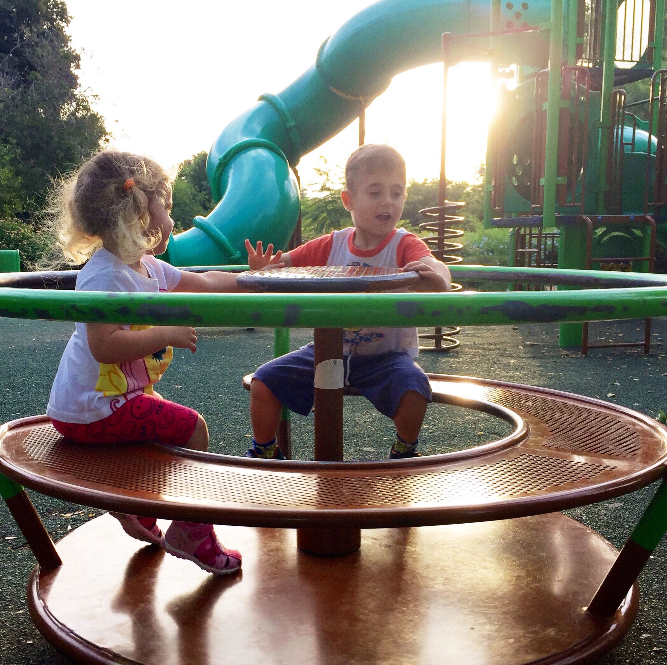 Kids have fun on playground rides