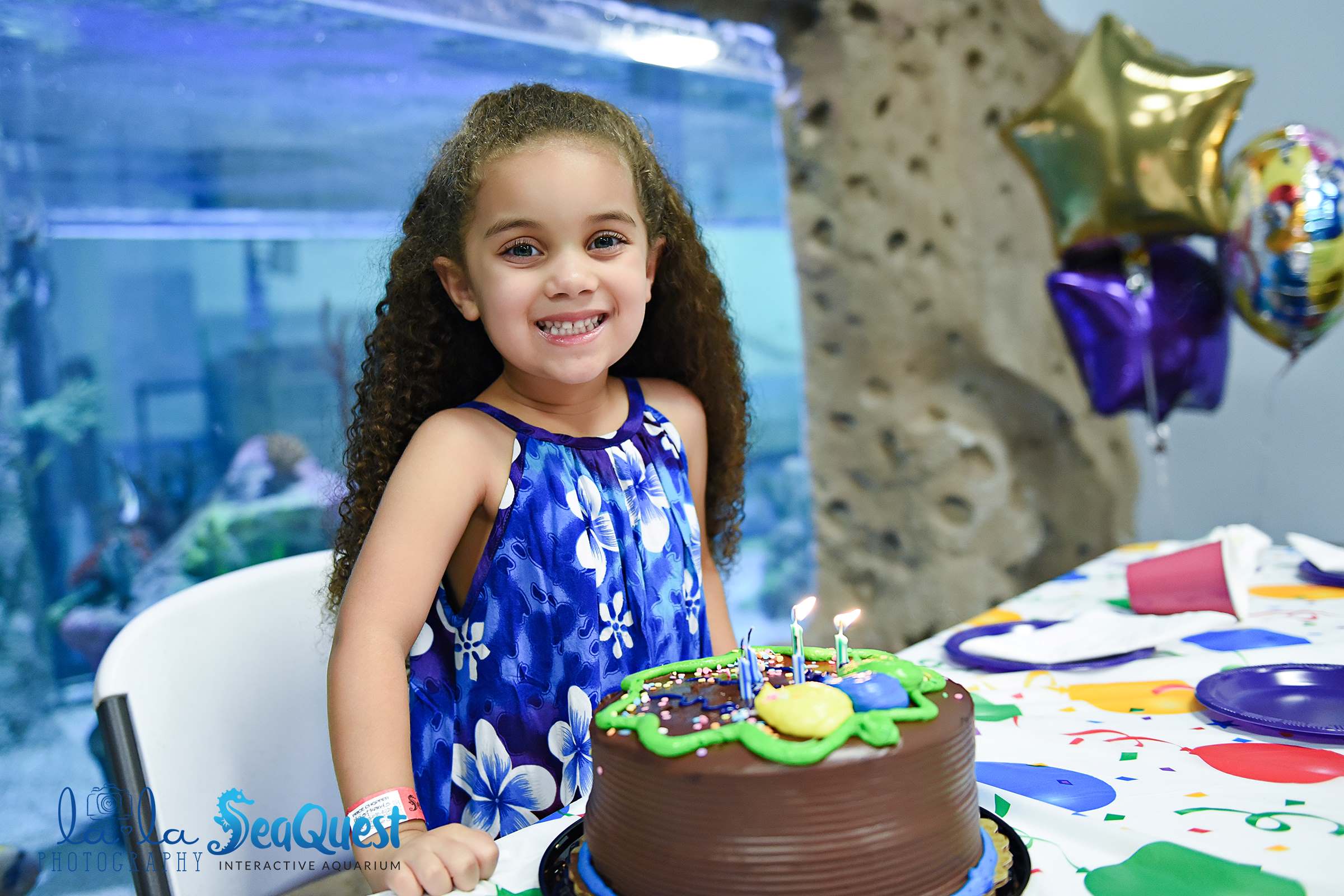 Birthday Girl with cake at SeaQuest Aquarium