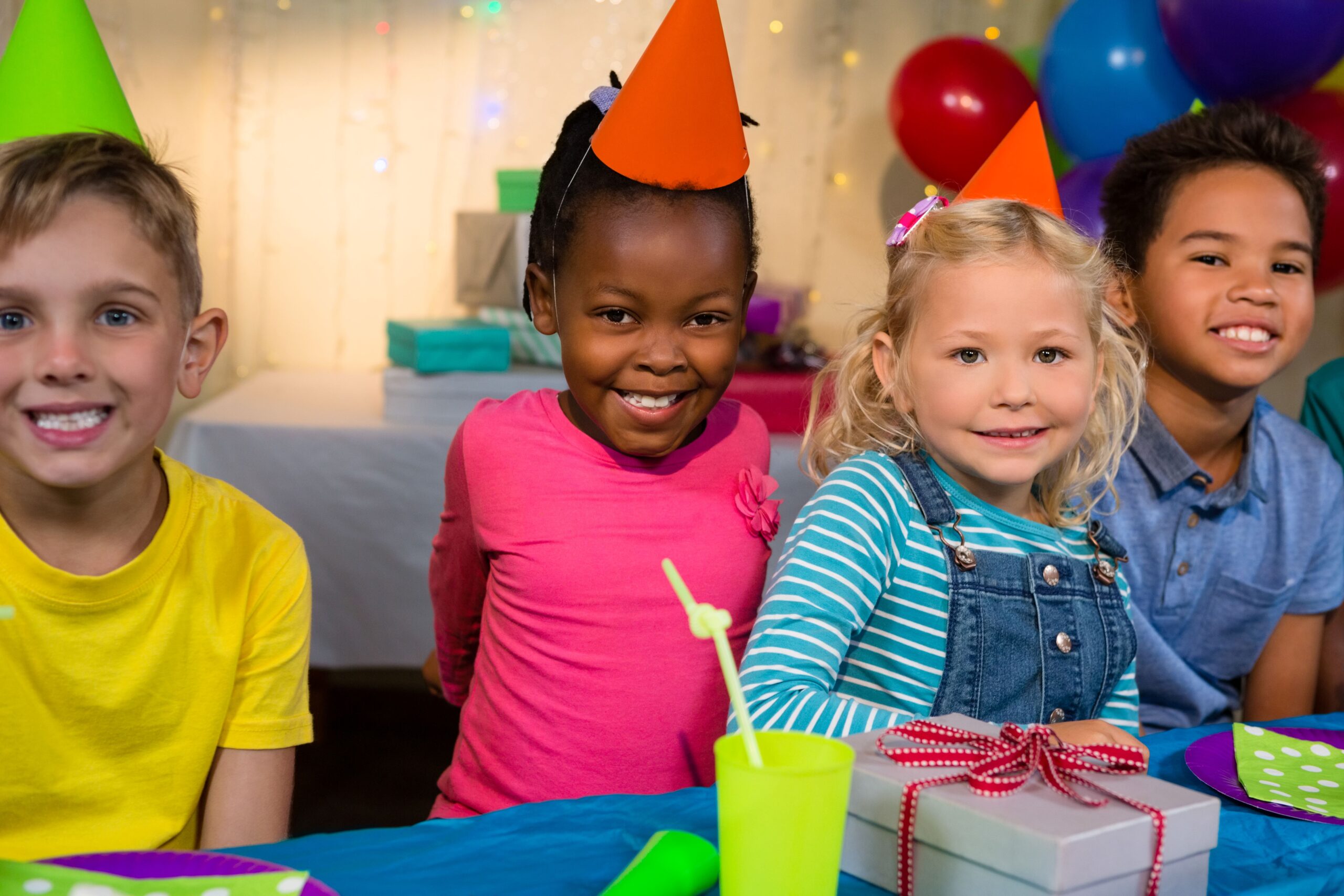 Kids smile at a birthday party